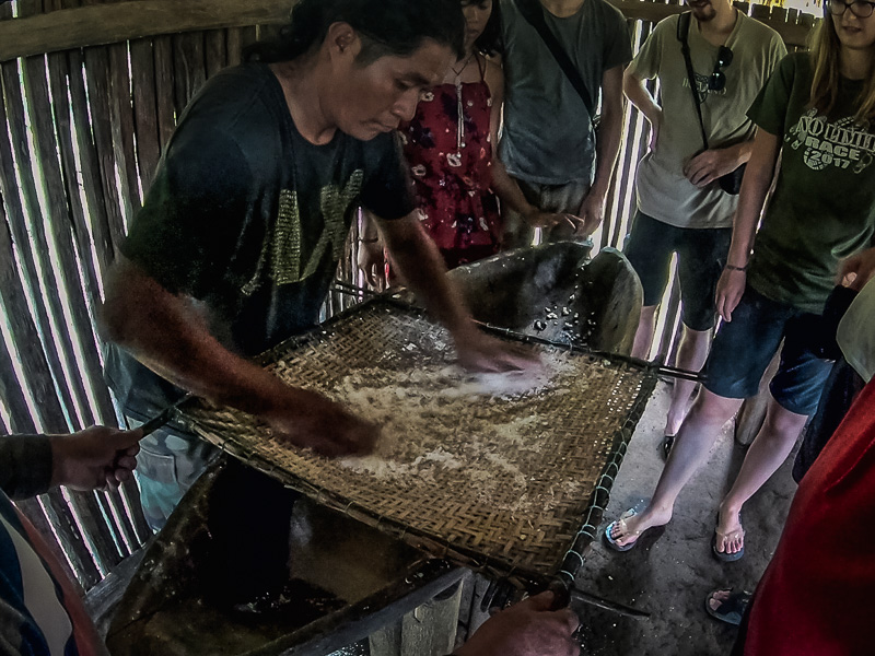 Sieving the mostly dry yuca flour