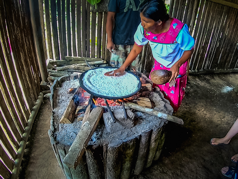 Placing the flour on the hot wood fired plate