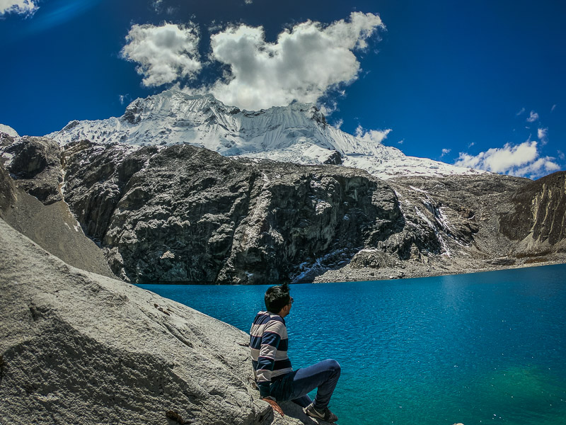 A view of the snow-topped peaks from some boulders