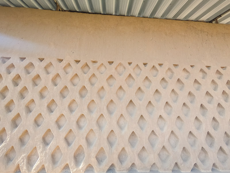 Restored wall carving of fishermen nets