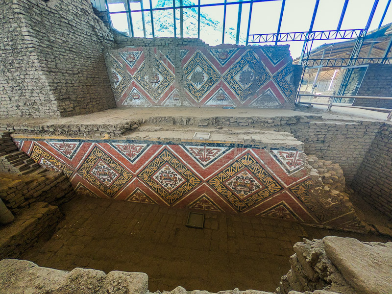 Excavated wall with decorations of the Mochia god