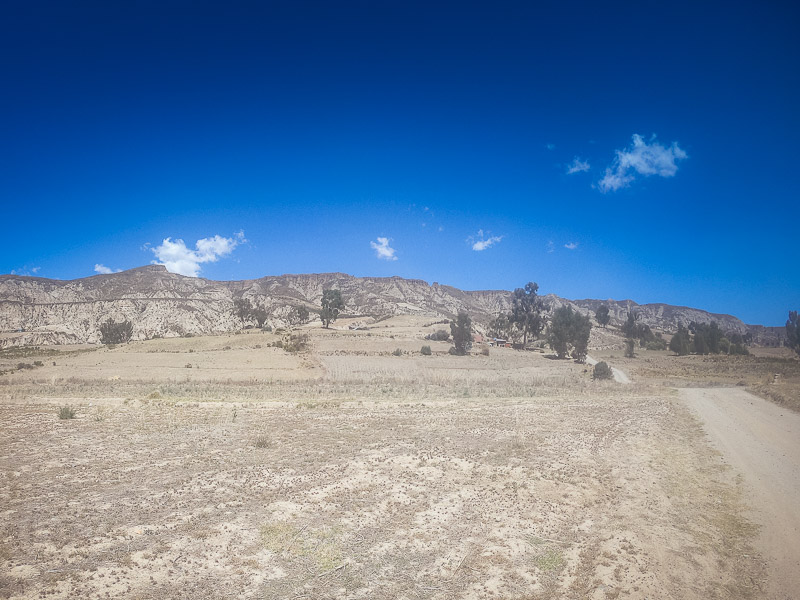 Second stop at the plain with moon-like mountain terrains in the background