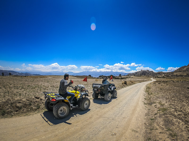 Second stop at the plain with moon-like mountain terrains in the background