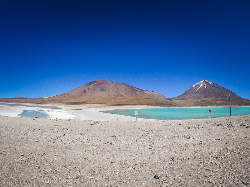 The green and white lake next to each other with volcano Licancabur in the background and White Lakes