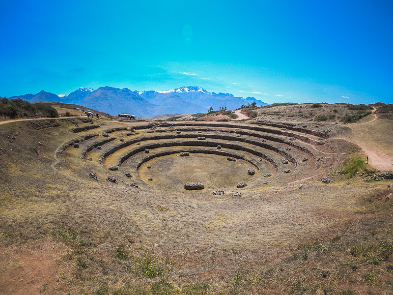 Circular agricultural terrace with the mountain range in the background