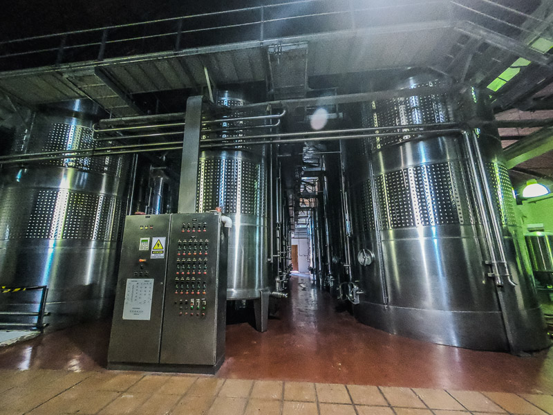 The distillery room with metal containers