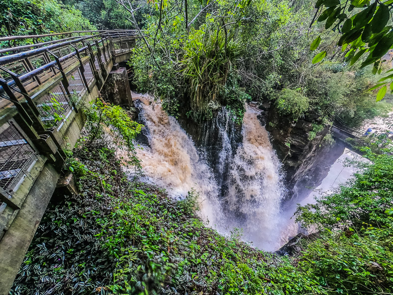 Walking past one of the falls on the Lower Circuit trail