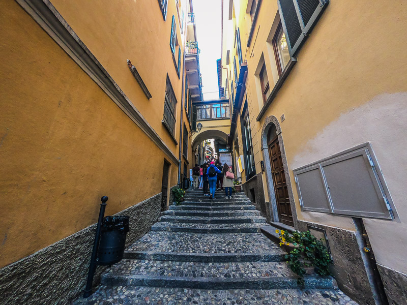 Narrow uphill path leading to restaurants in Bellagio