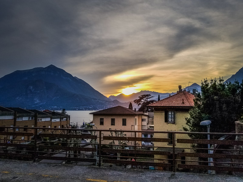 The sunset behind the mountains of the lake on the train journey back to Milan