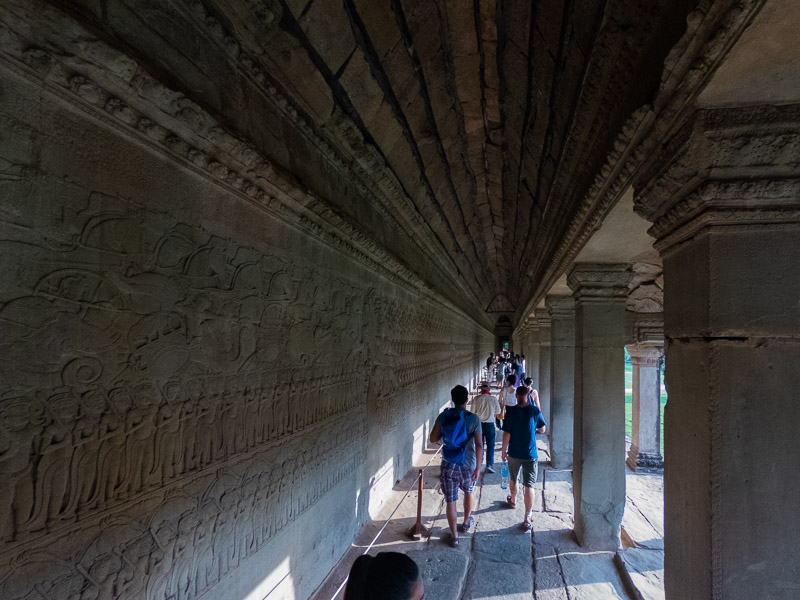 The carved murals around the perimeter of Angkor Wat