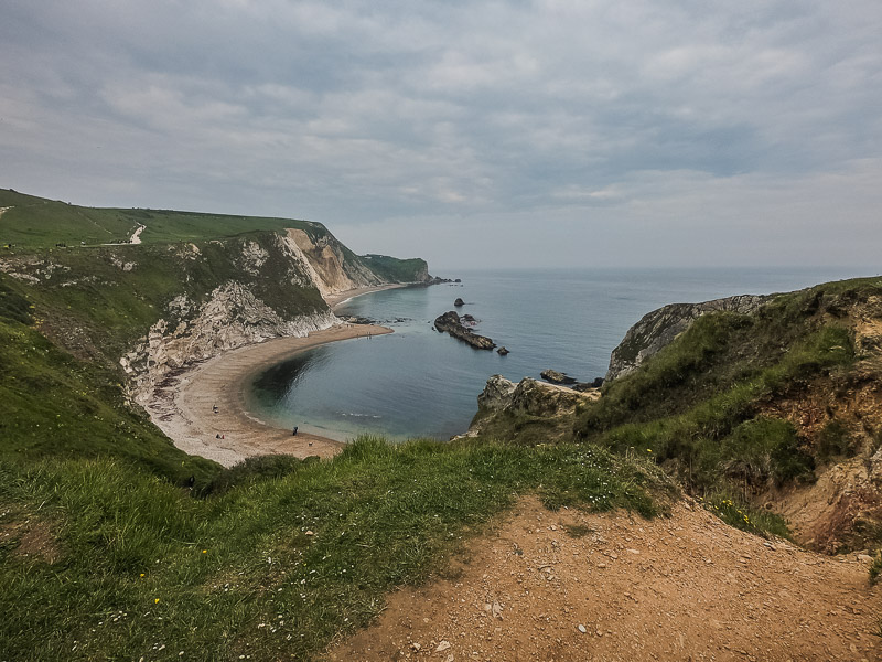 The beach behind limestone arch