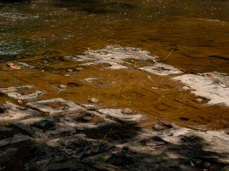 Tiles carved into the stream's bedrock