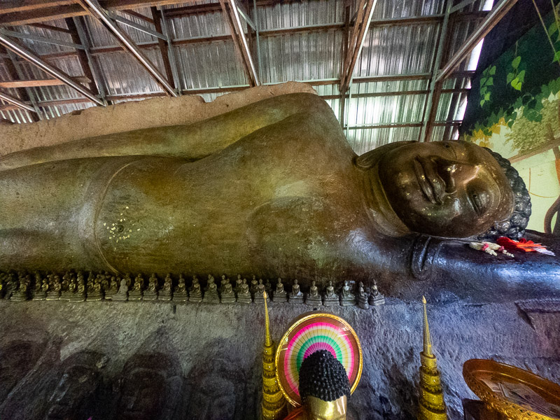 The reclining Buddha carved into the top of the largest rock