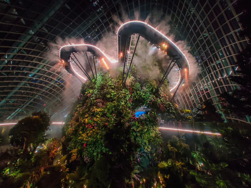 Looking up at the sky walk that emits a mist making it look like a cloud