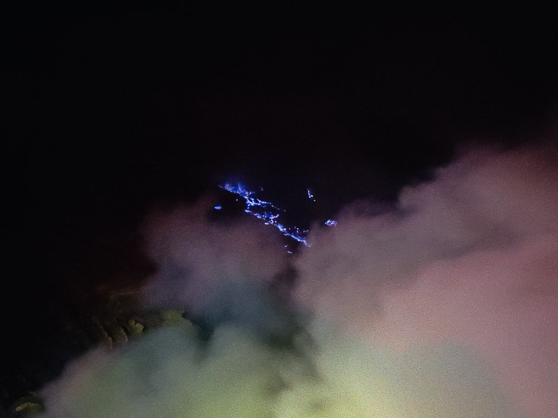 Blue fire hiding behind a sulfur cloud