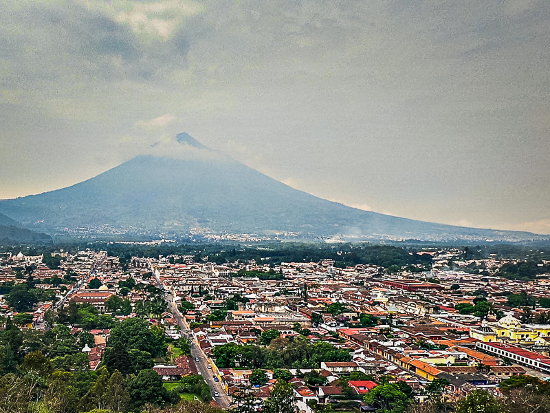 The city and volcano in the background