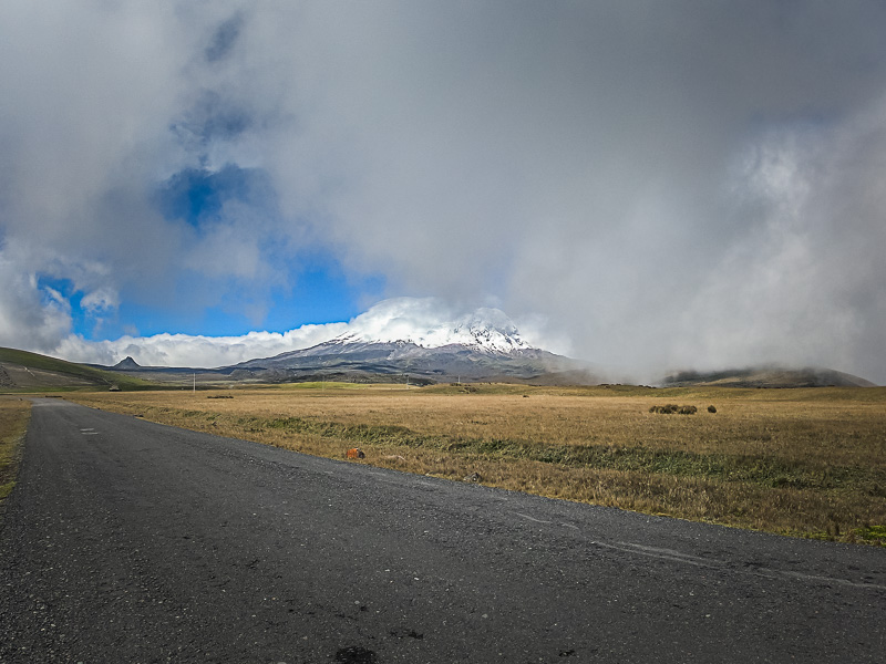 The snow-topped volcano hiding behind some clouds