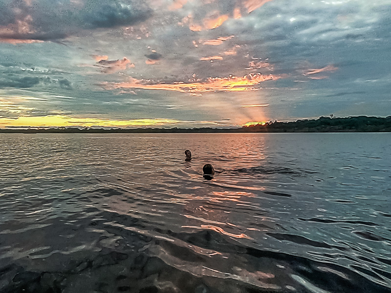 Going for a swim in Laguna Grande at sunset