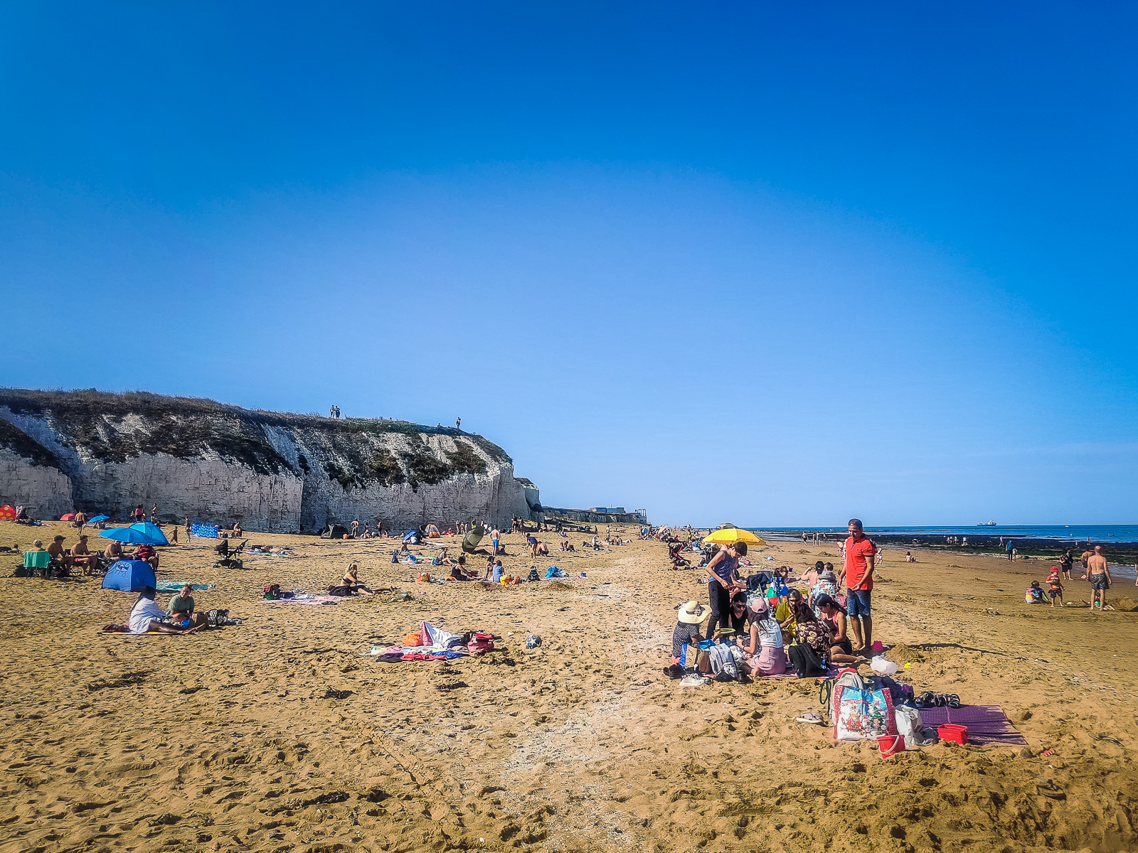 The beach with the white cliffs in the background