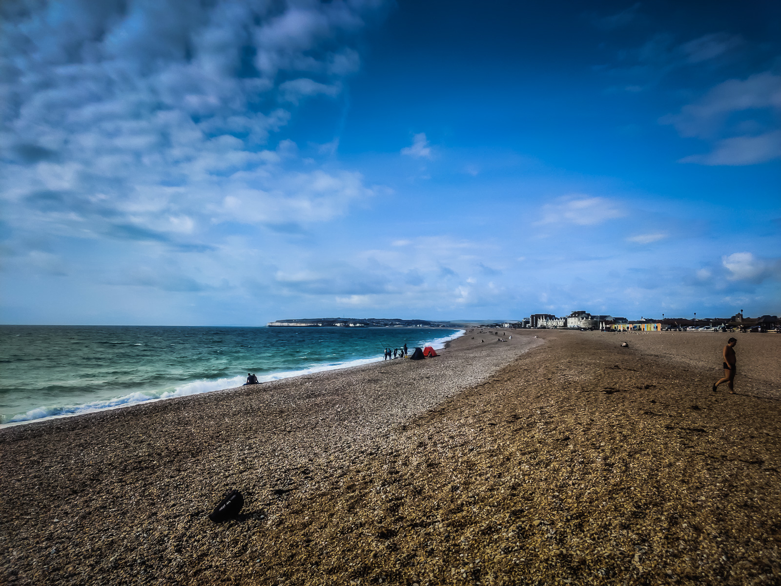 The stone beach with white cliffs in the distance