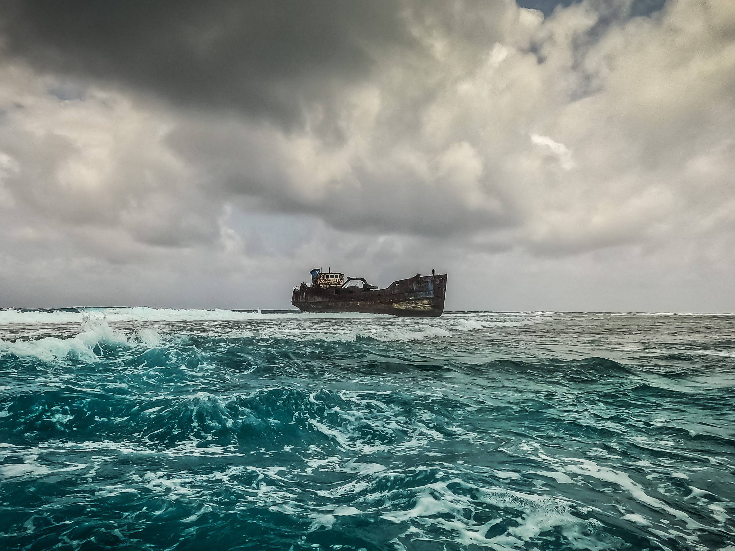 Abandoned ship that got stuck in the corals